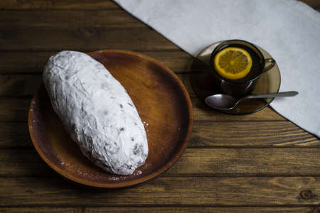 Bake on plate. Sweet addiction concept. Food harmful to diabetics, soft focus. Mug of tea on white napkin. Table decoration for delicious dessert.の写真素材