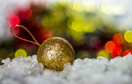 Gold Christmas Ball on defocused lights backgroundの写真素材