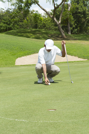 widely golf  course in very nice day summer with playerの写真素材