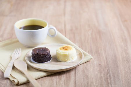 Hokkaido cheesecake with coffee cup with wooden backgroundの写真素材