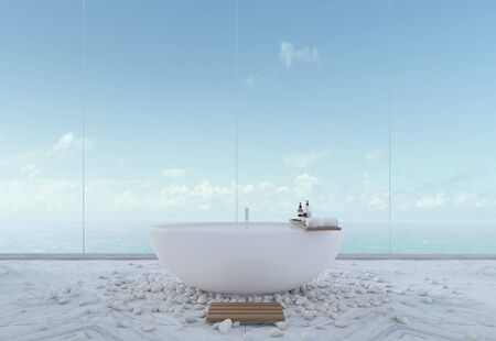 Luxury bathroom with sea view in hotel or home.Bathtub on marble floor with river rock. 3d renderingの写真素材