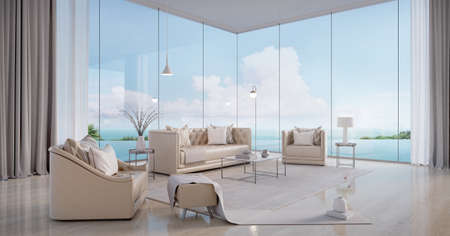 Luxury beach house.Sofa,armchair,stool,side table,lamps,curtains in living room with infinity edge...