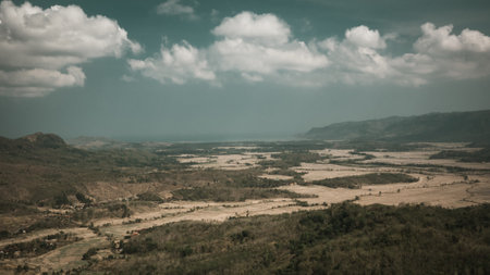 arid barren land with cloudy skies in the dry season