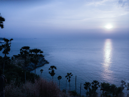 Sunset sky over sea. Aerial view from peak (top of mountain). Intense colors. Twilight landscape.の写真素材