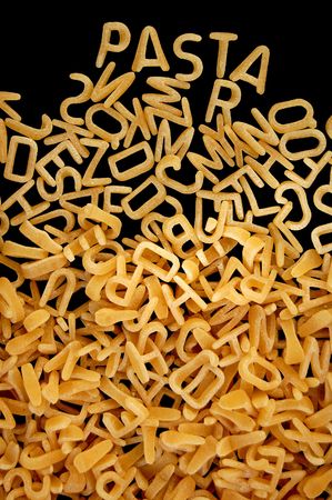 Spelling of the word pasta with alphabet soup letters.の写真素材
