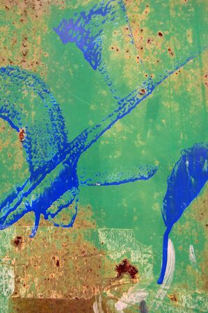 Weathered metal surface texture background with rust and dripping paint color.の写真素材