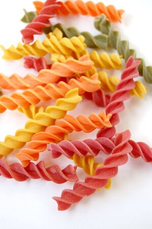 Flavors of fusilli pasta. Italian food on white background.の写真素材