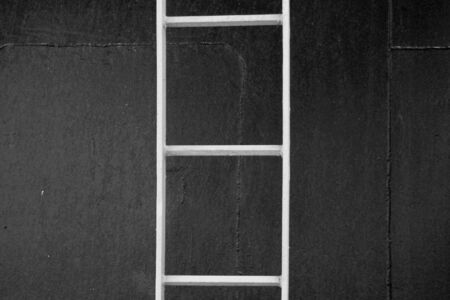 Metal ladder on a ferry boat. Abstract geometric background. Black and white.の写真素材