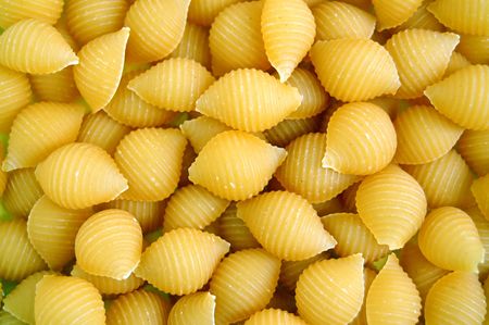 Shells pasta background. Italian food texture detail.の写真素材