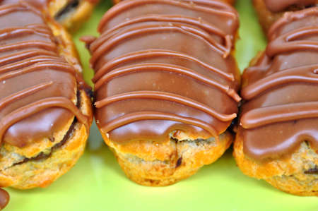 Chocolate covered eclair sweet dessert. Selective focus.
