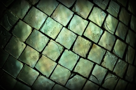 Stained broken glass squares texture macro. Abstract background selective focus.の写真素材