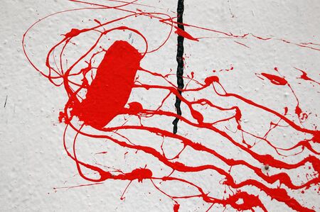 Wall stained with red paint. Abstract texture.の写真素材