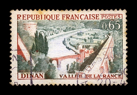 FRANCE - CIRCA 1963. Vintage canceled postage stamp with town of Dinan and river Rance illustration, circa 1963.の写真素材