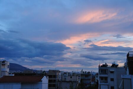 Dawn over the city of Athens, Greece  Sunrise colors and cloudy sky の写真素材