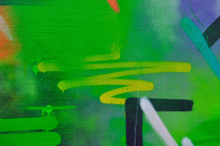 Paint stained wall abstract smudged overlapping graffiti background texture.の写真素材