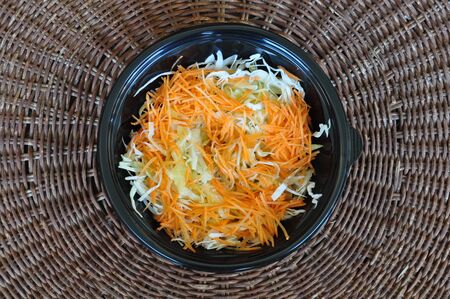 Bowl of cabbage and carrot fresh vegetables salad. Food background.の写真素材