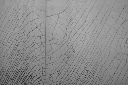 Cracked and weathered plastic window insulation film shrink abstract background.の写真素材