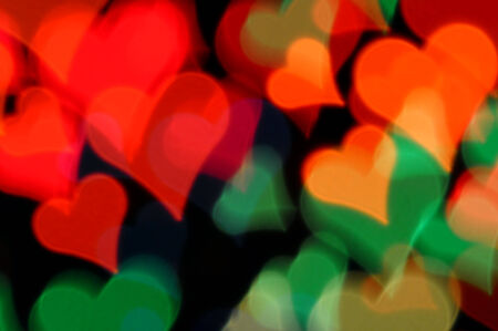 Colorful hearts abstract blur at night. Valentine's day happy background.の写真素材
