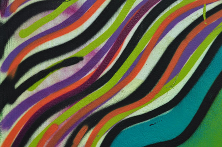 Abstract colorful lines pattern artistic background. Graffiti spray paint on wall texture.の写真素材