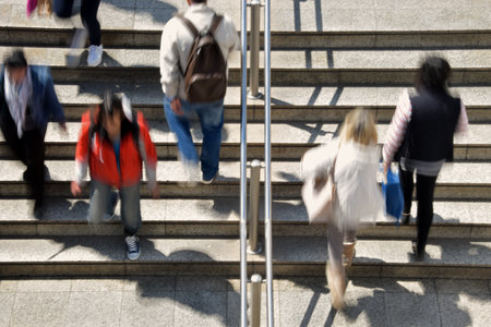 Busy people on subway station steps abstract motion blur. Daily life urban street scene.のeditorial素材