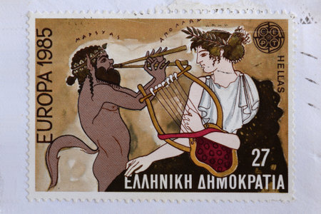 GREECE  CIRCA 1985: Marsyas greek mythology satyr plays aulos double flute on music challenge that cost him his life against Apollo ancient god of music and the arts. Illustration on vintage postage stamp printed by the Hellenic Post.のeditorial素材