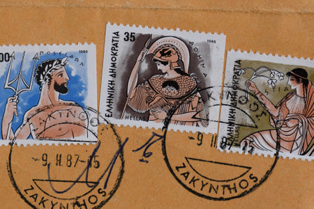 GREECE  CIRCA 1986: Poseidon ancient greek god of the sea Athena goddess of wisdom and Hestia goddess of home and family values mythology illustrations on vintage postage stamps printed and postmarked by the Hellenic Post.のeditorial素材