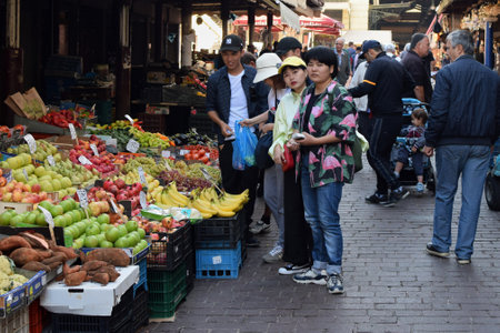 ATHENS, GREECE - OCTOBER 2, 2018: People buying groceries at fruit and vegetable market in downtown Athens.のeditorial素材