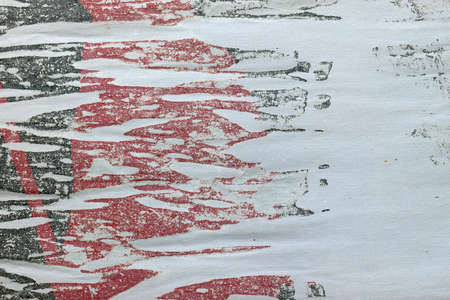 Torn poster glue stains on textured paper. Abstract grunge background with copy space.