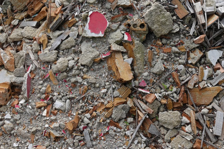 Pile of rubble broken bricks and construction material from a demolished house.