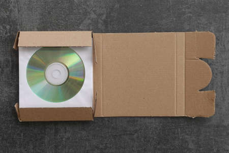 CD packed in cardboard mailer shipping box.