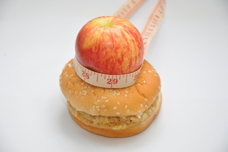 red apple with tape measure and hamburgerの写真素材