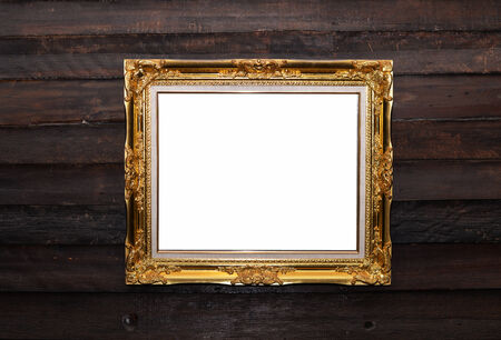 golden frame on wooden wall
