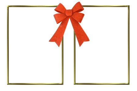 Gold frames for two pictures together with a red bow isolated on white backgroundの写真素材