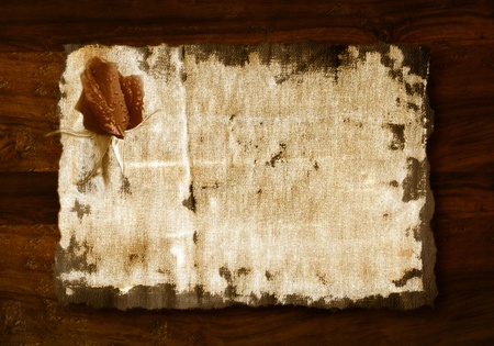 romantic background, rosebud in old fabric on wooden backgroundの写真素材