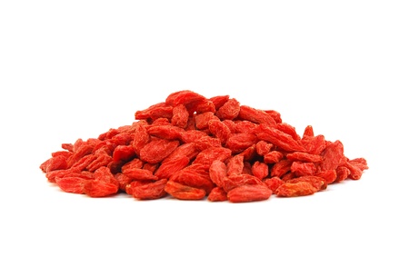 pile of goji berries isolated on white background の写真素材