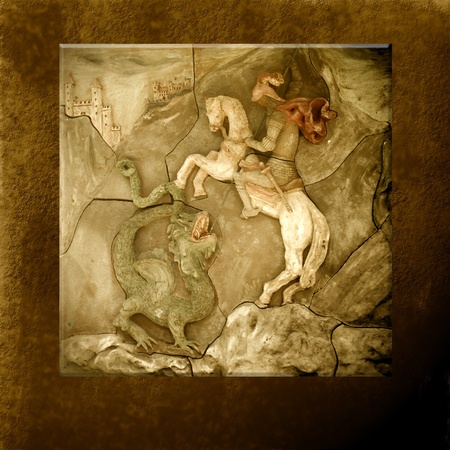 sculpture of St. George and the dragon in sepia toneの写真素材