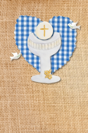 cute card first communion, chalice in burlap rustic backgroundの写真素材