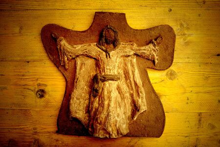 clay jesus card on wooden backgroundの写真素材