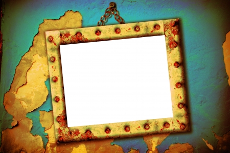 Empty frame hanging on a broken wall, urban styleの写真素材