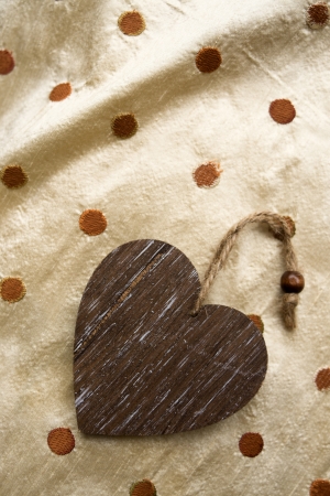 riser card, wooden heart on fabric backgroundの写真素材
