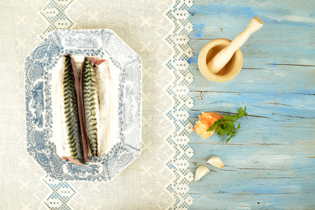 Fresh mackerel and ingredient  in old tray on rustic backgroundの写真素材