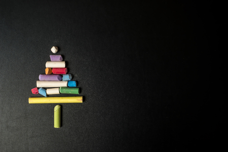 Christmas background, Christmas tree made with colored chalk on a blackboardの写真素材