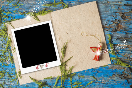 Christmas Angel greeting card, cute rustic ornament and blank photo frame with copy space to write...