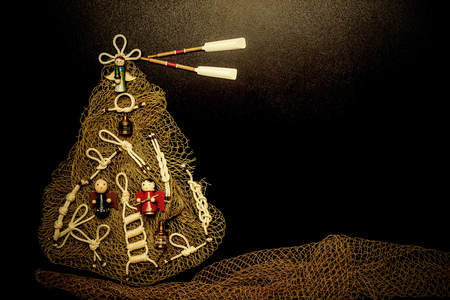 Christmas tree marine style card with blank space, made with knots, sailors nets and angels on...