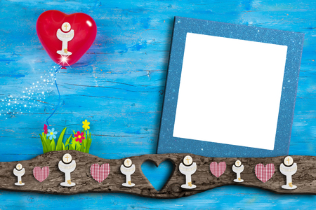 First Holy Communion invitations, chalice, heart  balloon and flowers on blue wooden background with empty photo frame for text and photosの写真素材
