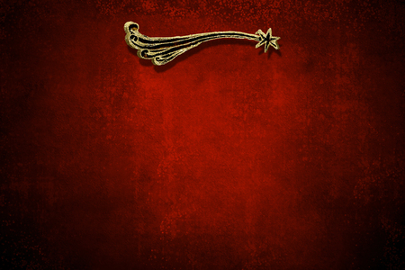 Christmas Nativity greetings cards, Star of Bethlehem with gold texture on blank grunge  dark red backgroundの写真素材