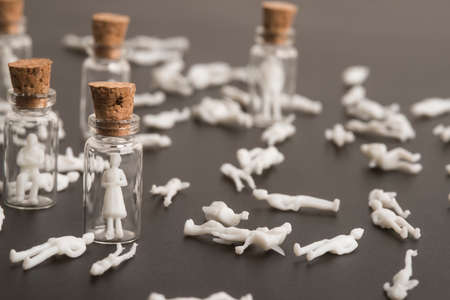 Covid-19 pandemic, coronavirus victims, old woman and people protected, concept. Figures inside...