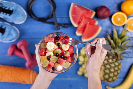 Fruit salad making fresh fruits with sports equipmentの写真素材