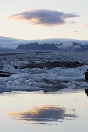 glacier lake on iceland with reflecion of a cloud