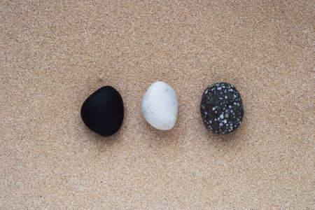 Tree stacked stones on sand background; zen conceptの写真素材
